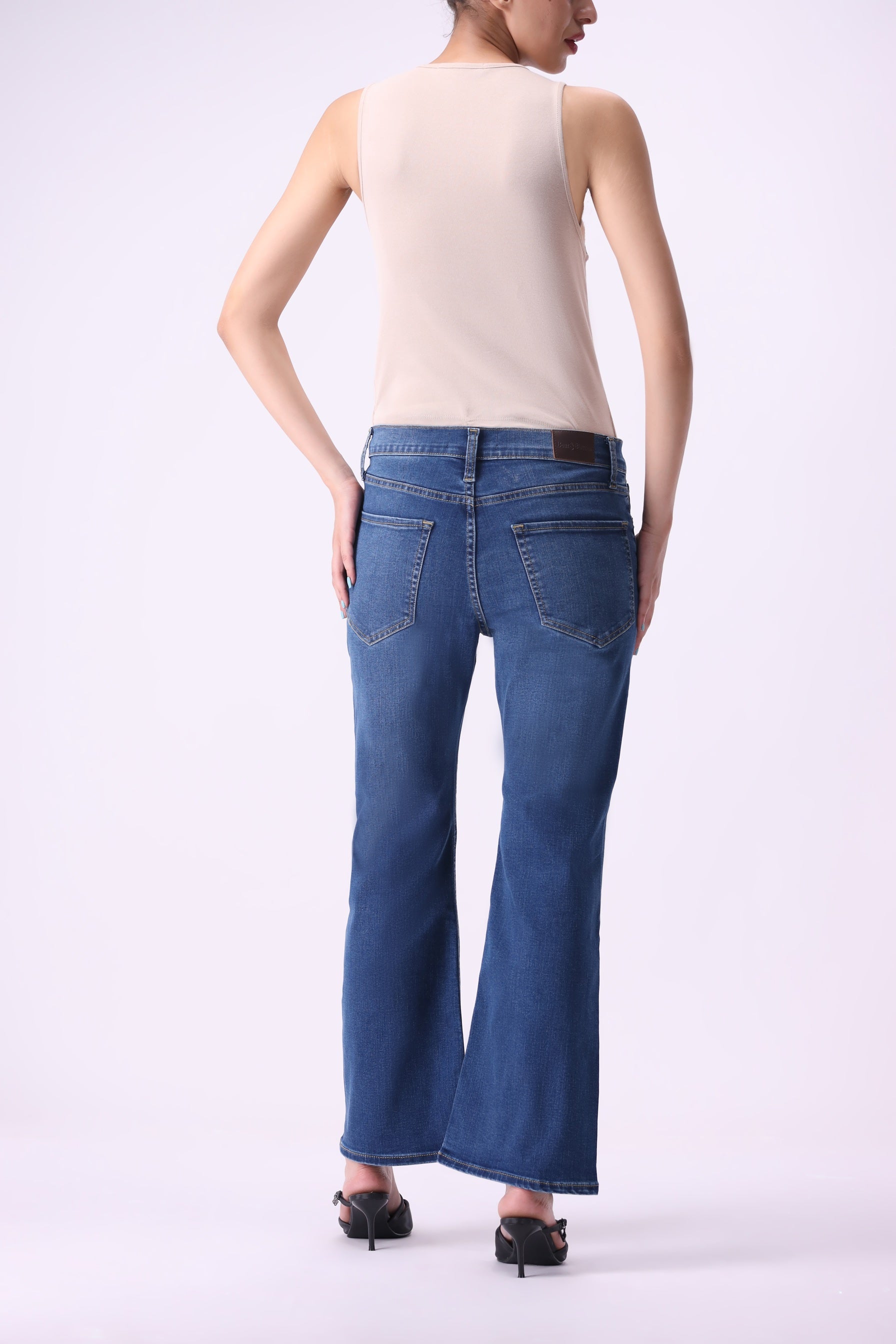 Back view of Bear & Birches Canoe women’s bootcut flare jeans, medium blue wash