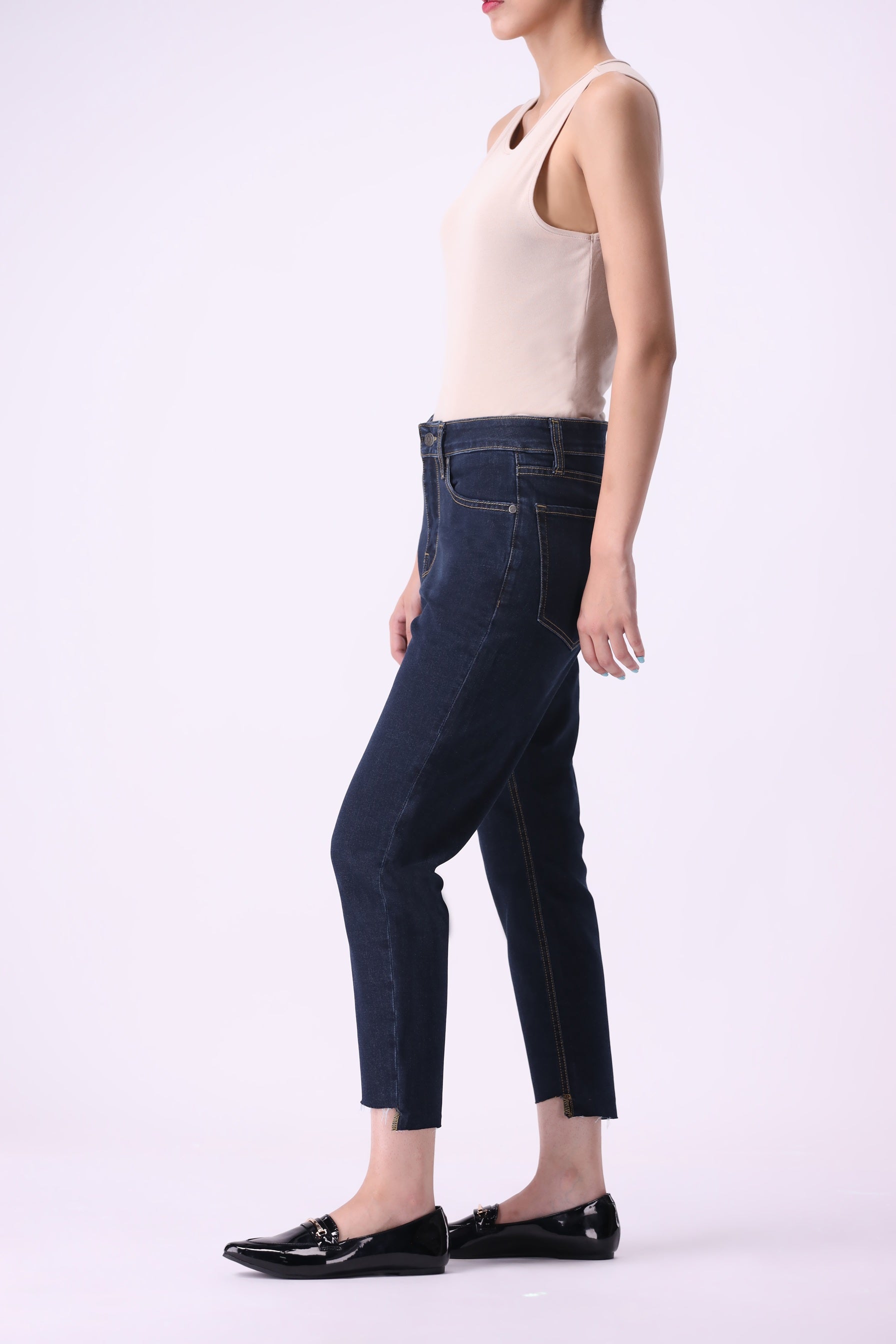 Side view of Bear & Birches Birke women’s high-rise tapered relaxed jeans, ankle length, dark wash