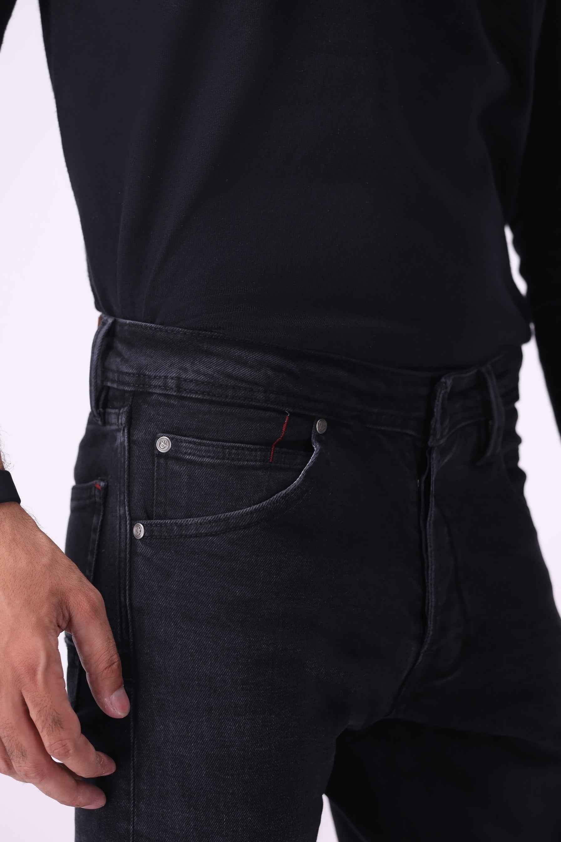 Close-up front view of Atlas black jeans highlighting the durable construction and premium sustainable denim texture.