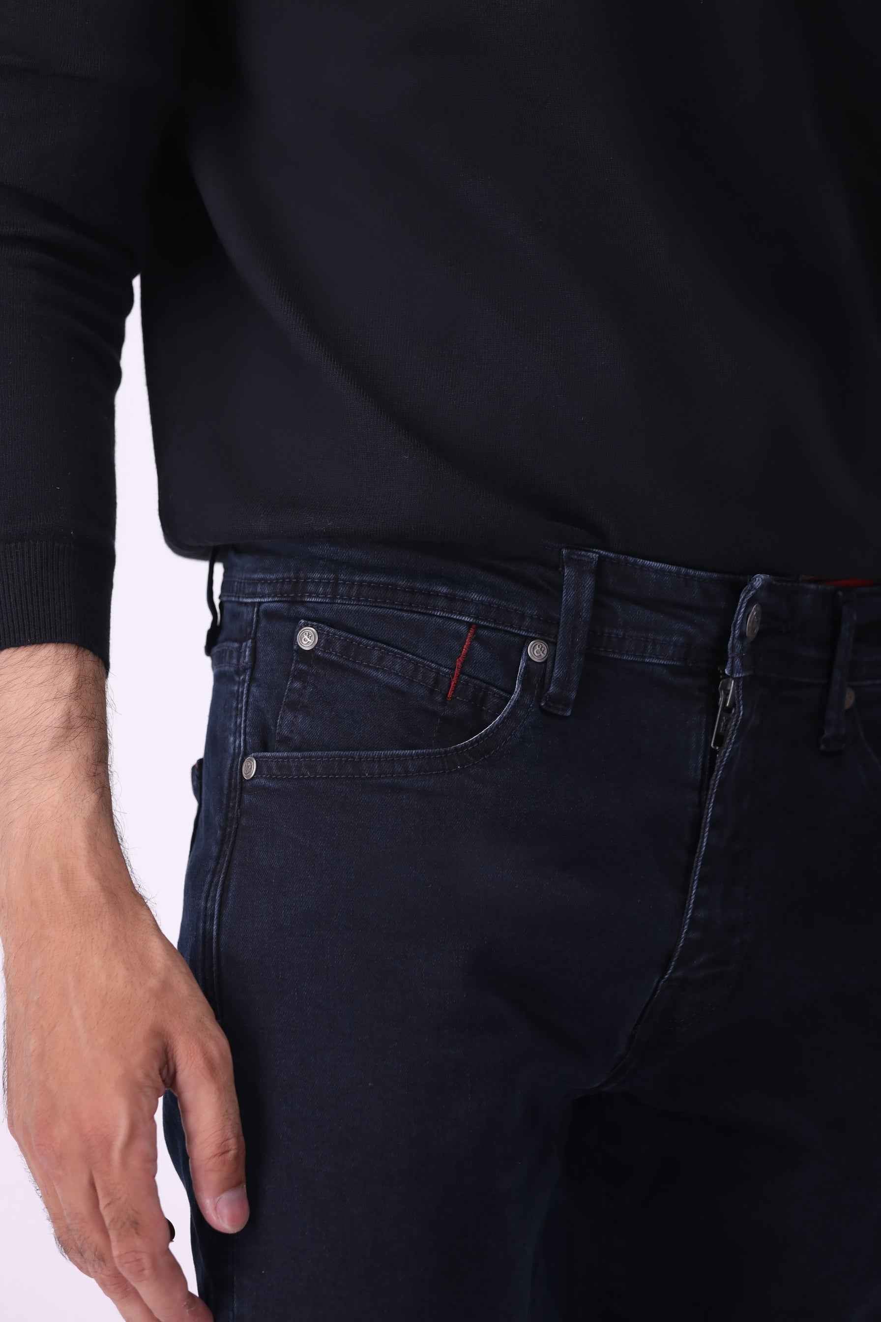 Close-up front view of Grizzly jeans highlighting the durable denim texture and high-quality hardware on a black indigo wash.