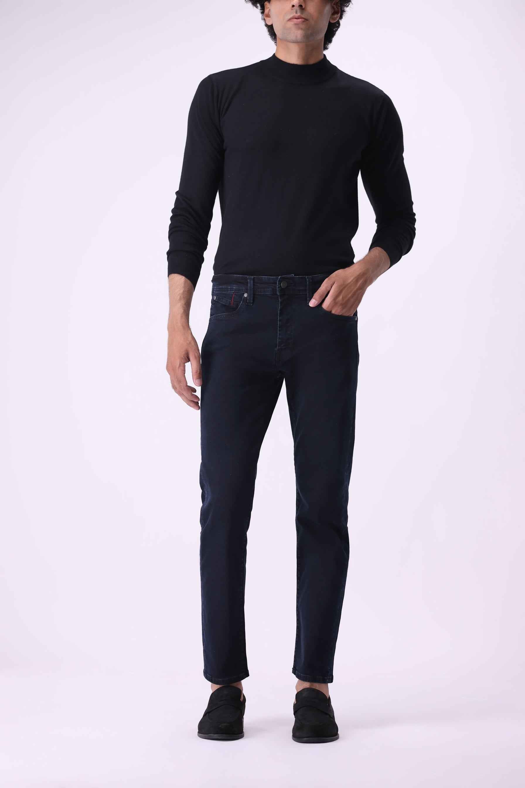 Grizzly men's slim-fit jeans in a deep black indigo finish, crafted from heavyweight organic and PCW recycled cotton.