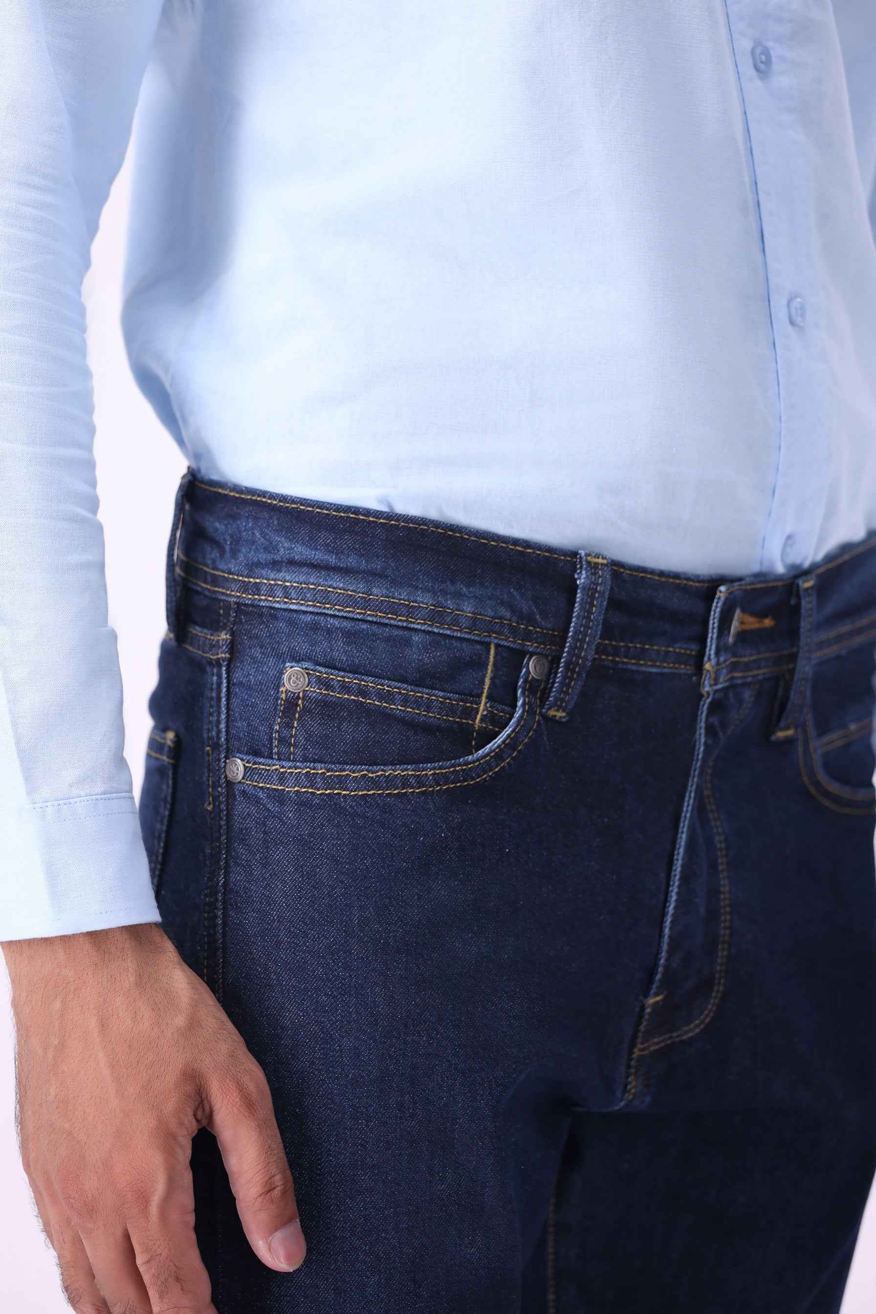 Close-up front view of Kuma indigo jeans highlighting the premium sustainable denim texture and high-quality finish.