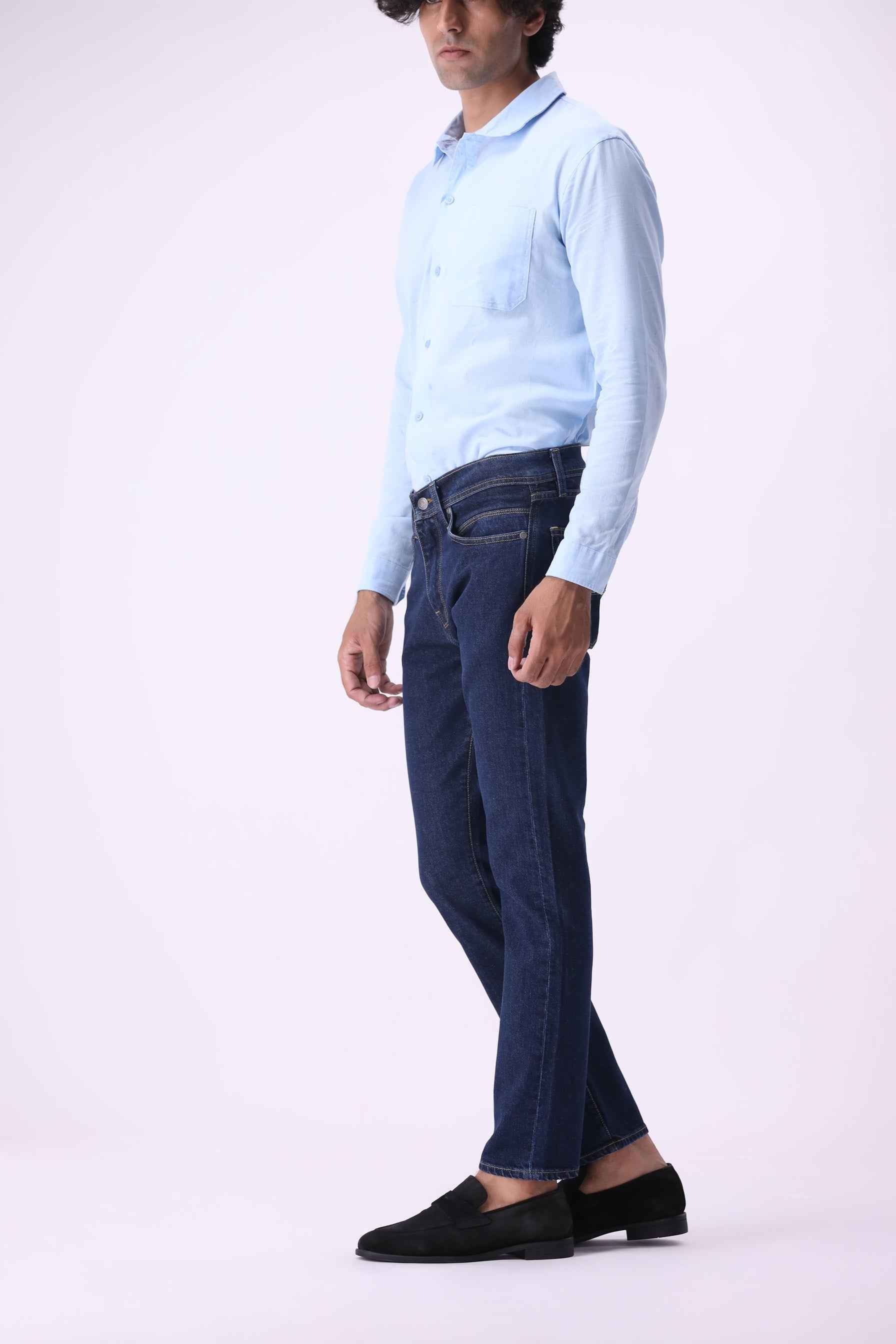 Side profile of Kuma men's slim straight jeans showing the tailored fit and 25% comfort stretch recovery.