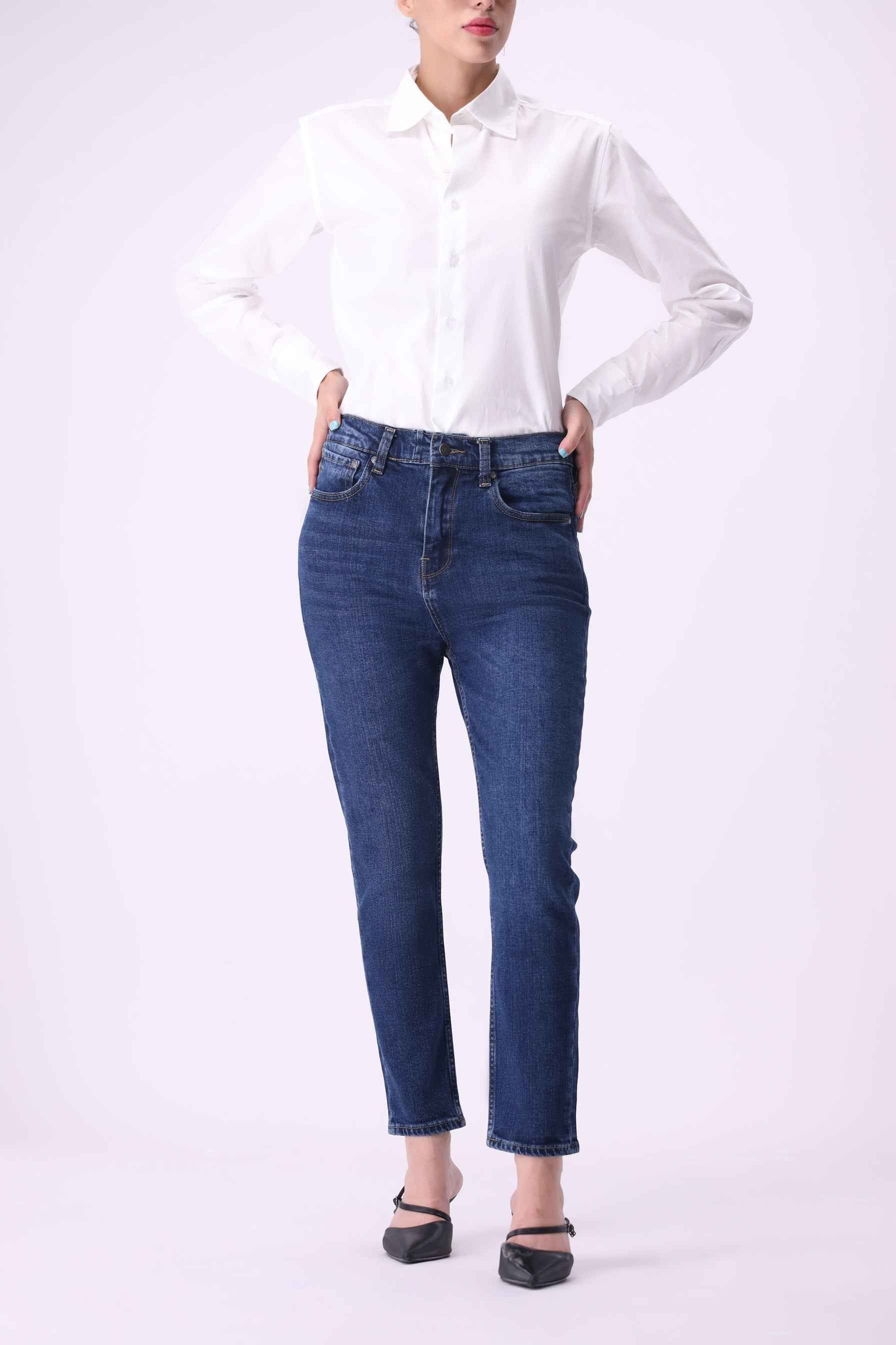 Shirakaba women's boyfriend jeans in Mid Indigo, featuring a premium blend of 50% organic and 49% BCI cotton.