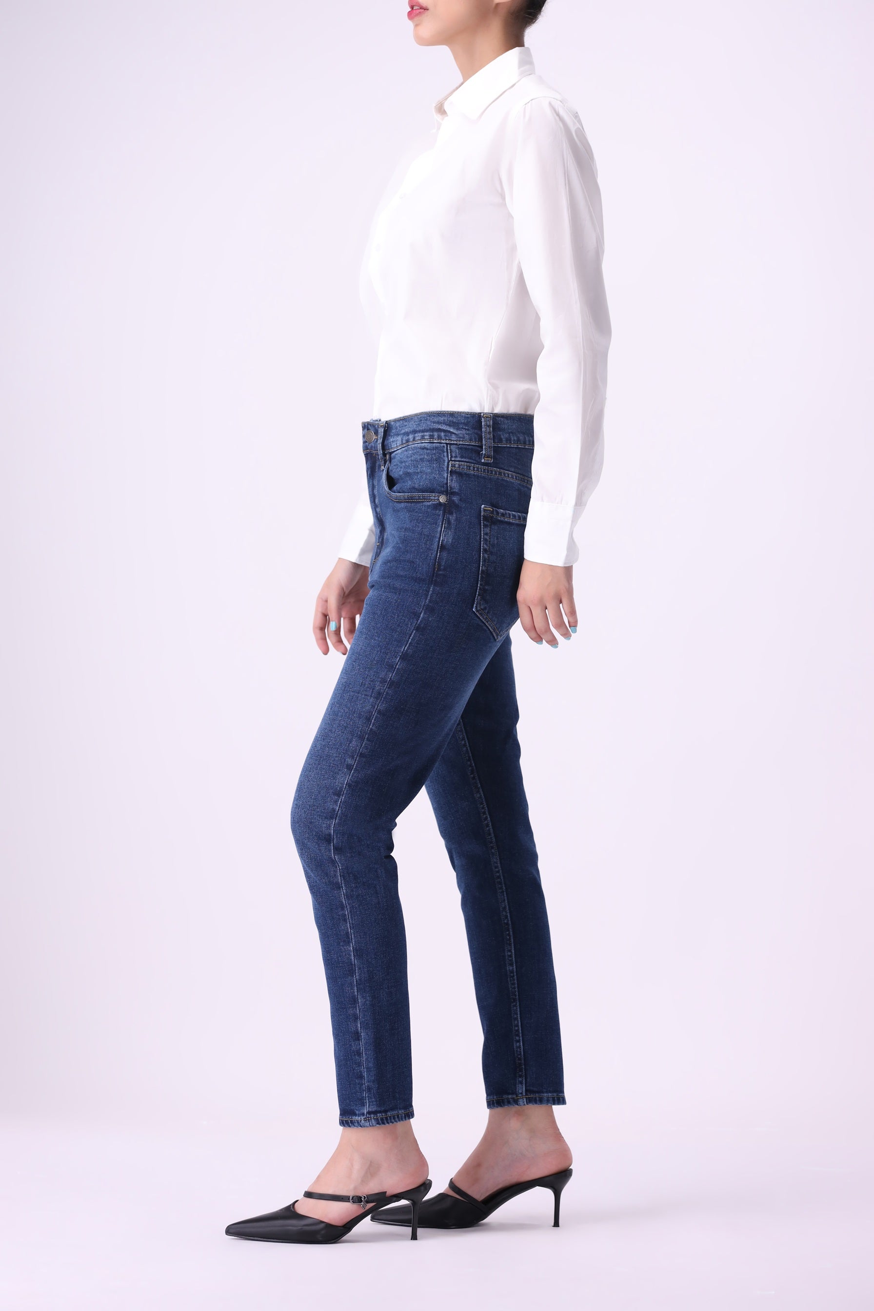 Side view of women’s Shirikaba dark indigo high-rise boyfriend jeans with tapered relaxed fit.