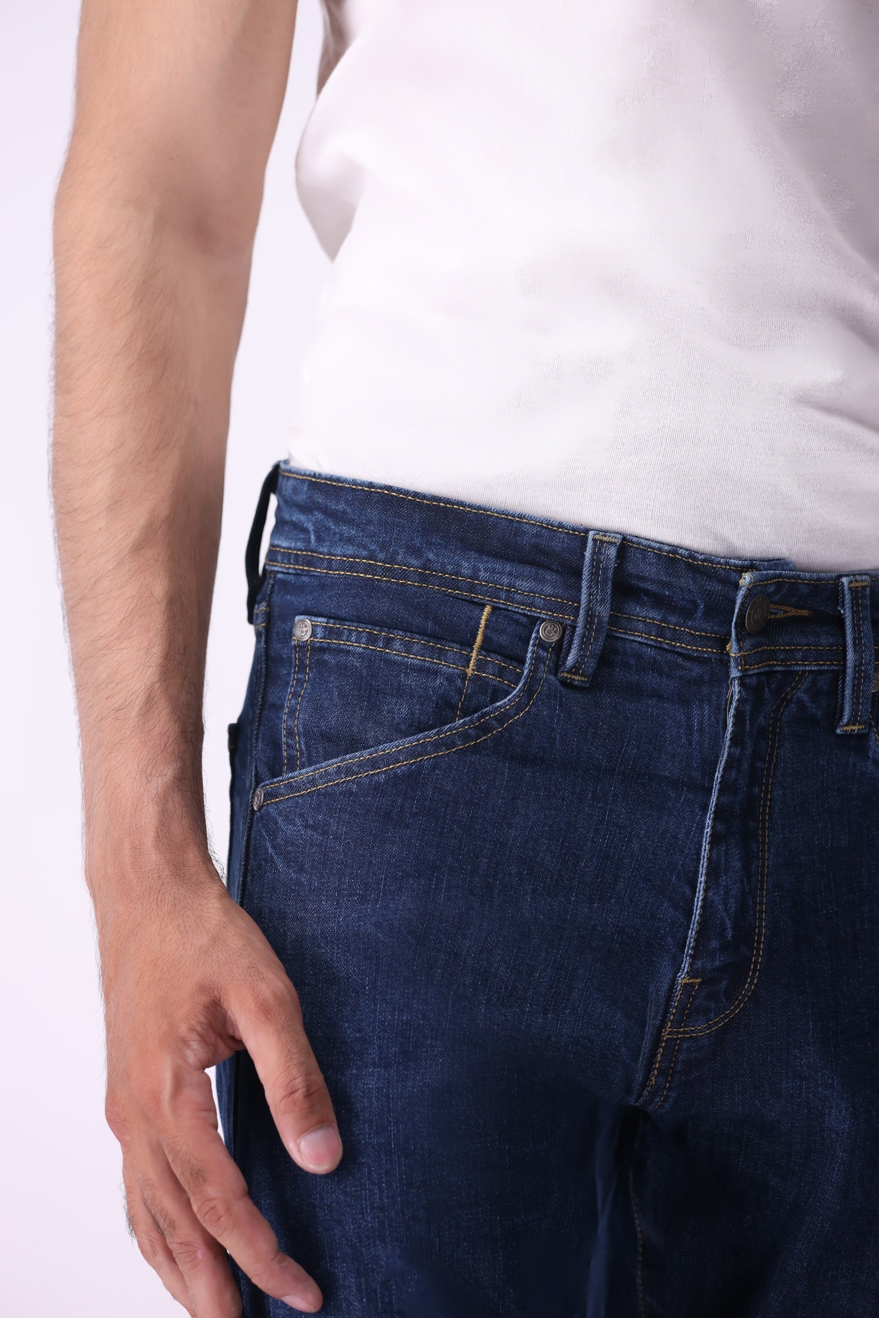 Close-up of Bear & Birches Ursa men’s jeans in dark blue wash, front waist view