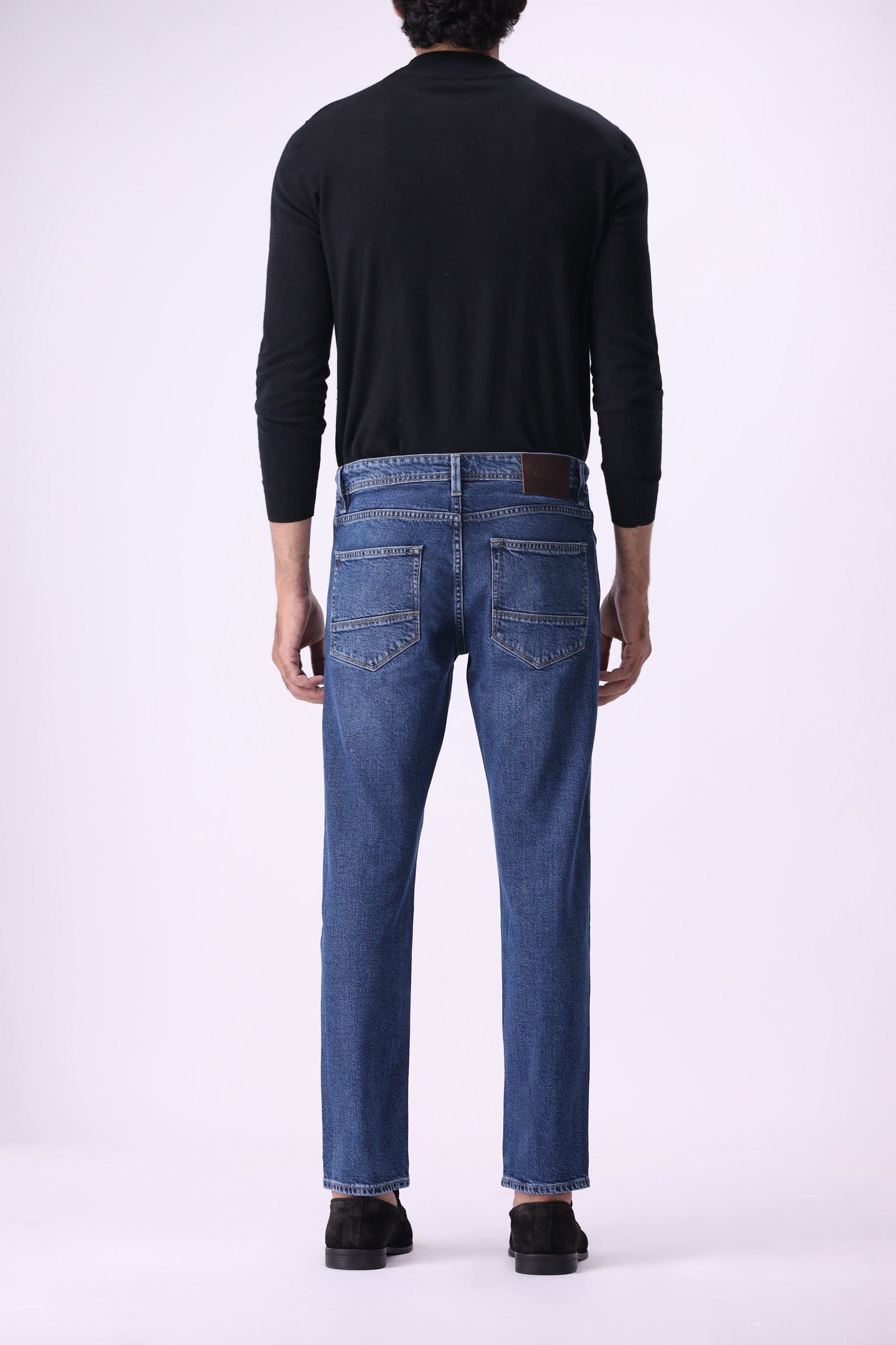 Men’s relaxed-fit jeans dark indigo back view – Benji sustainable denim