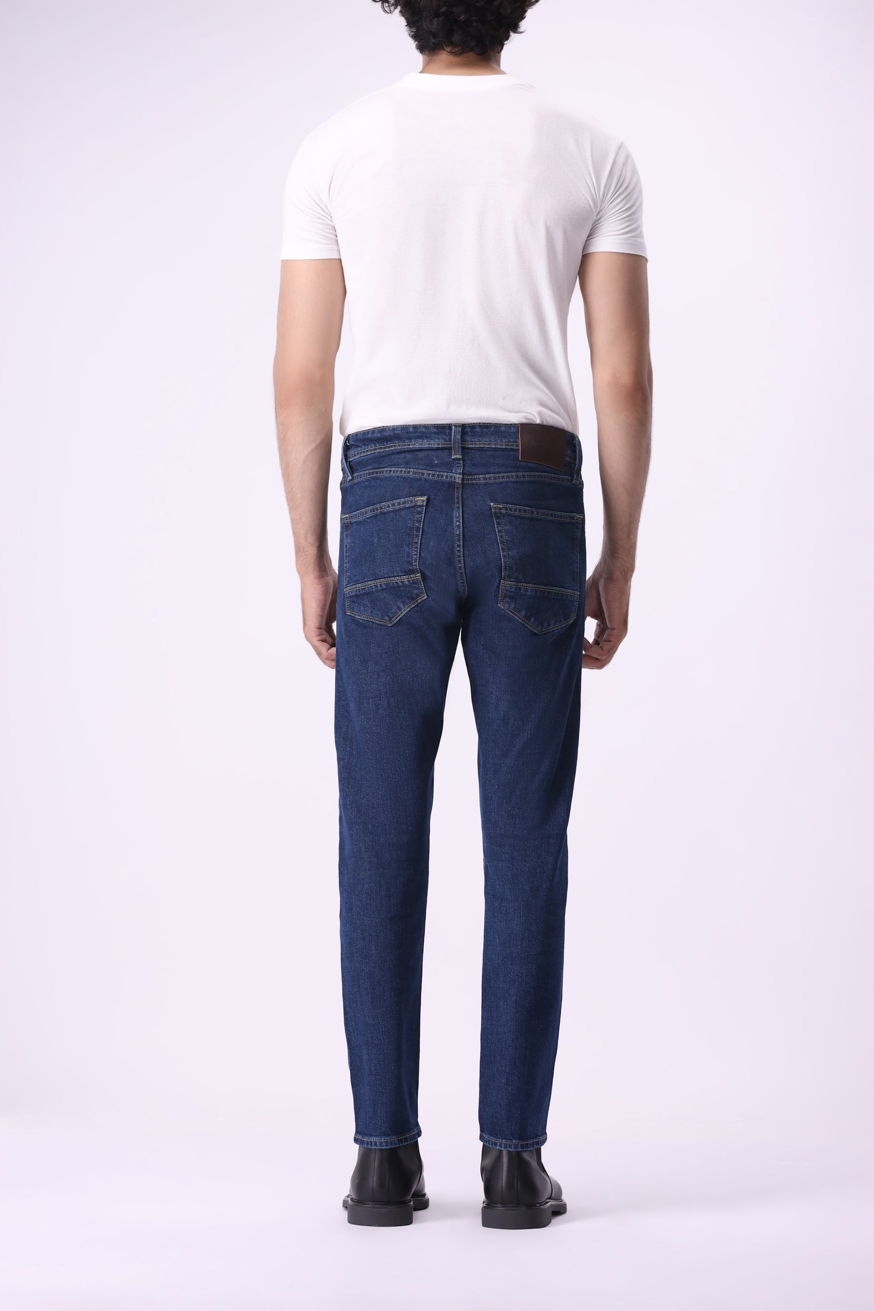 Full back view of Bear & Birches Ursa men’s jeans in dark blue wash, straight leg fit