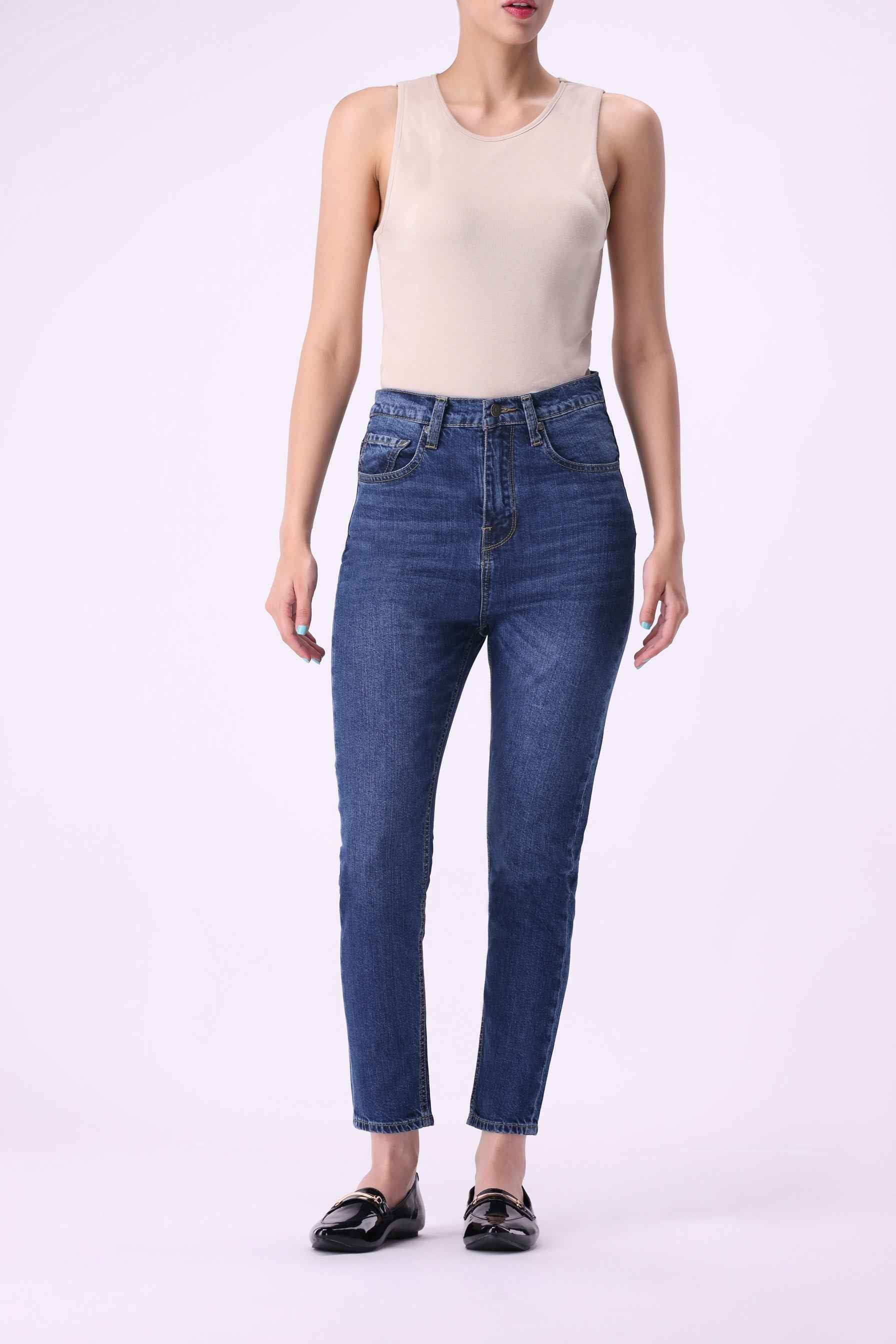Abedul women's high-rise skinny jeans in an indigo wash, featuring 50% organic cotton and 20% recycled cotton.