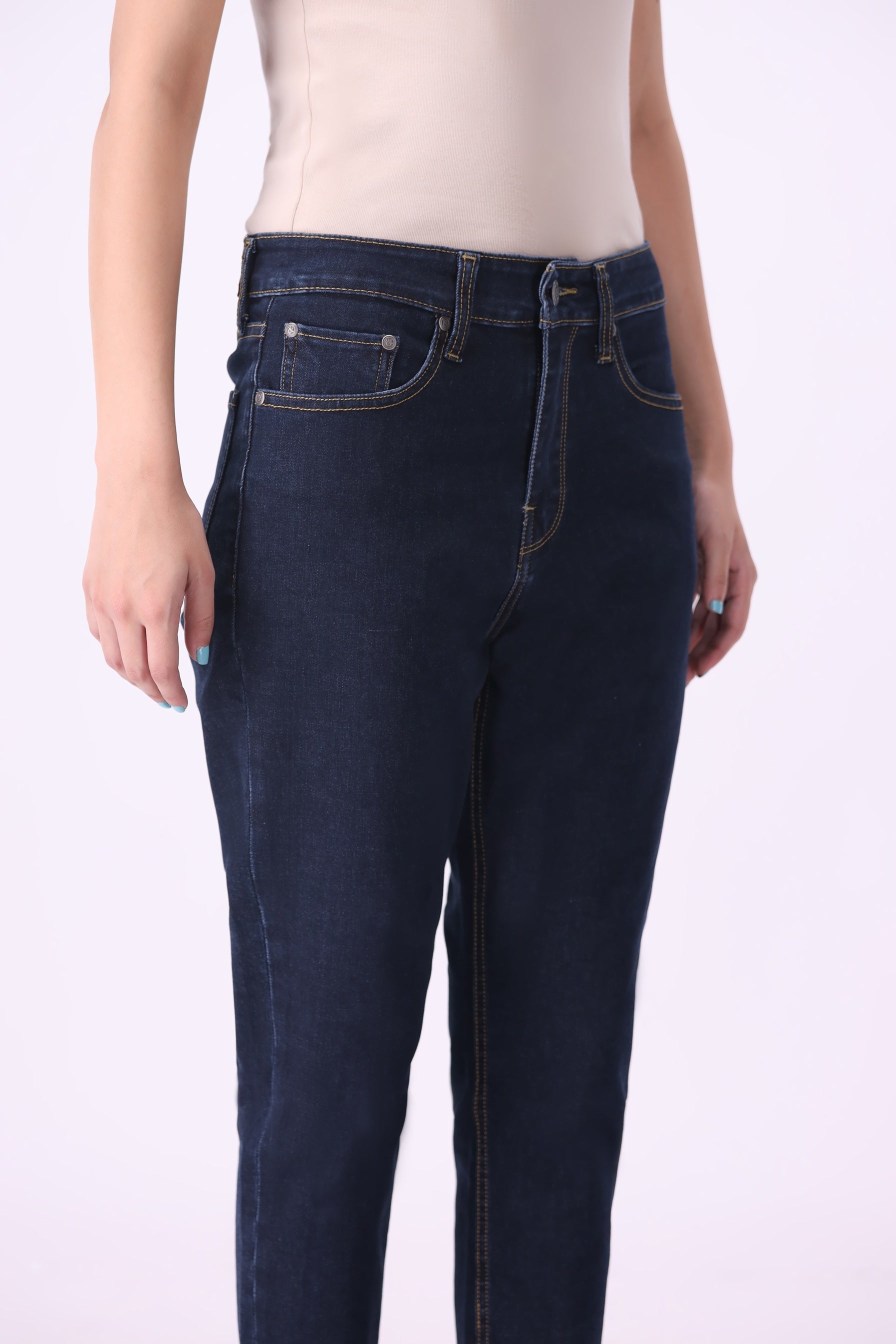 Close-up of Bear & Birches Birke women’s high-rise tapered ankle jeans in dark wash