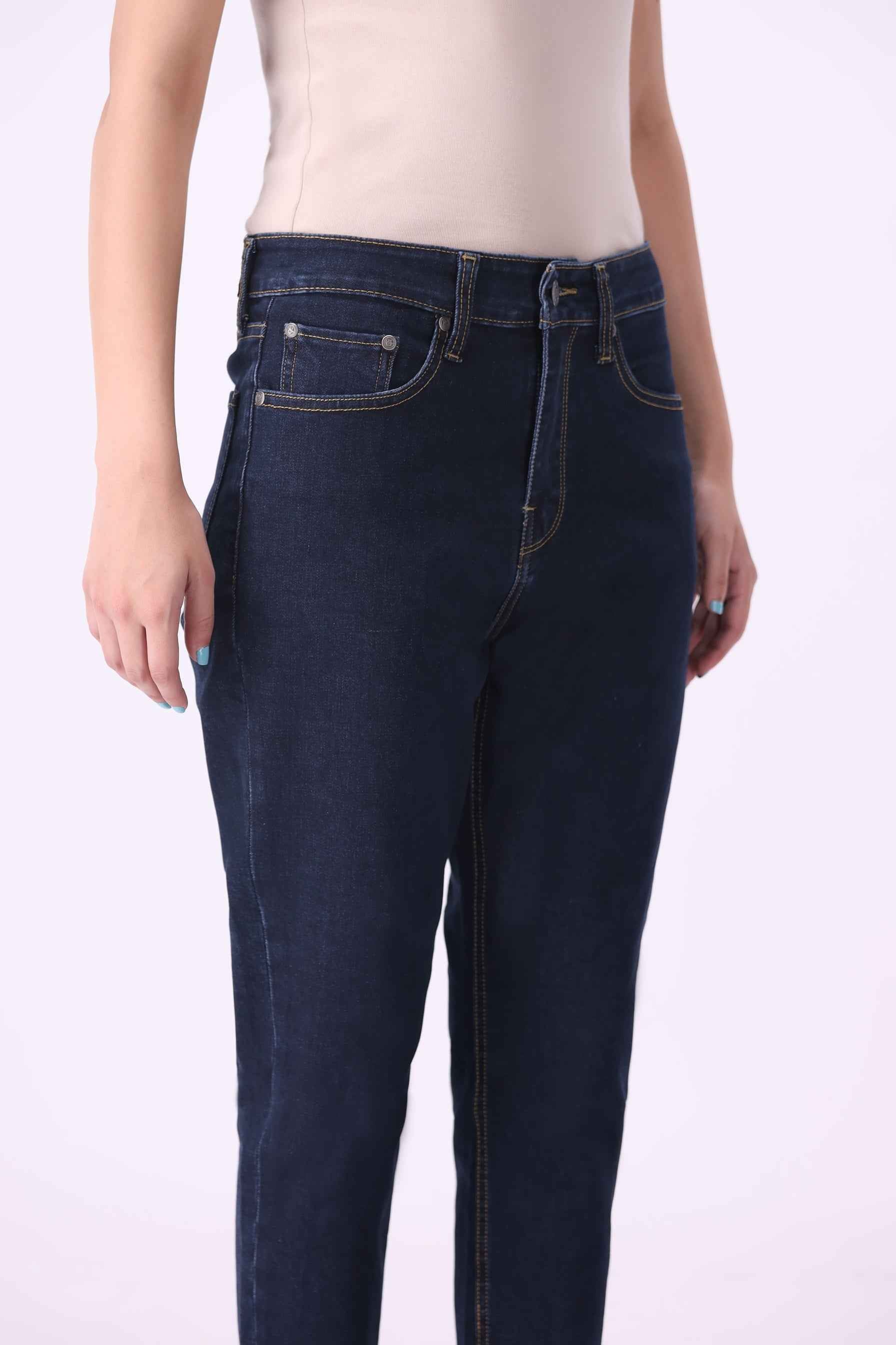 Close-up front view of Birke high-rise jeans highlighting the sleek dark indigo wash and premium stitching.
