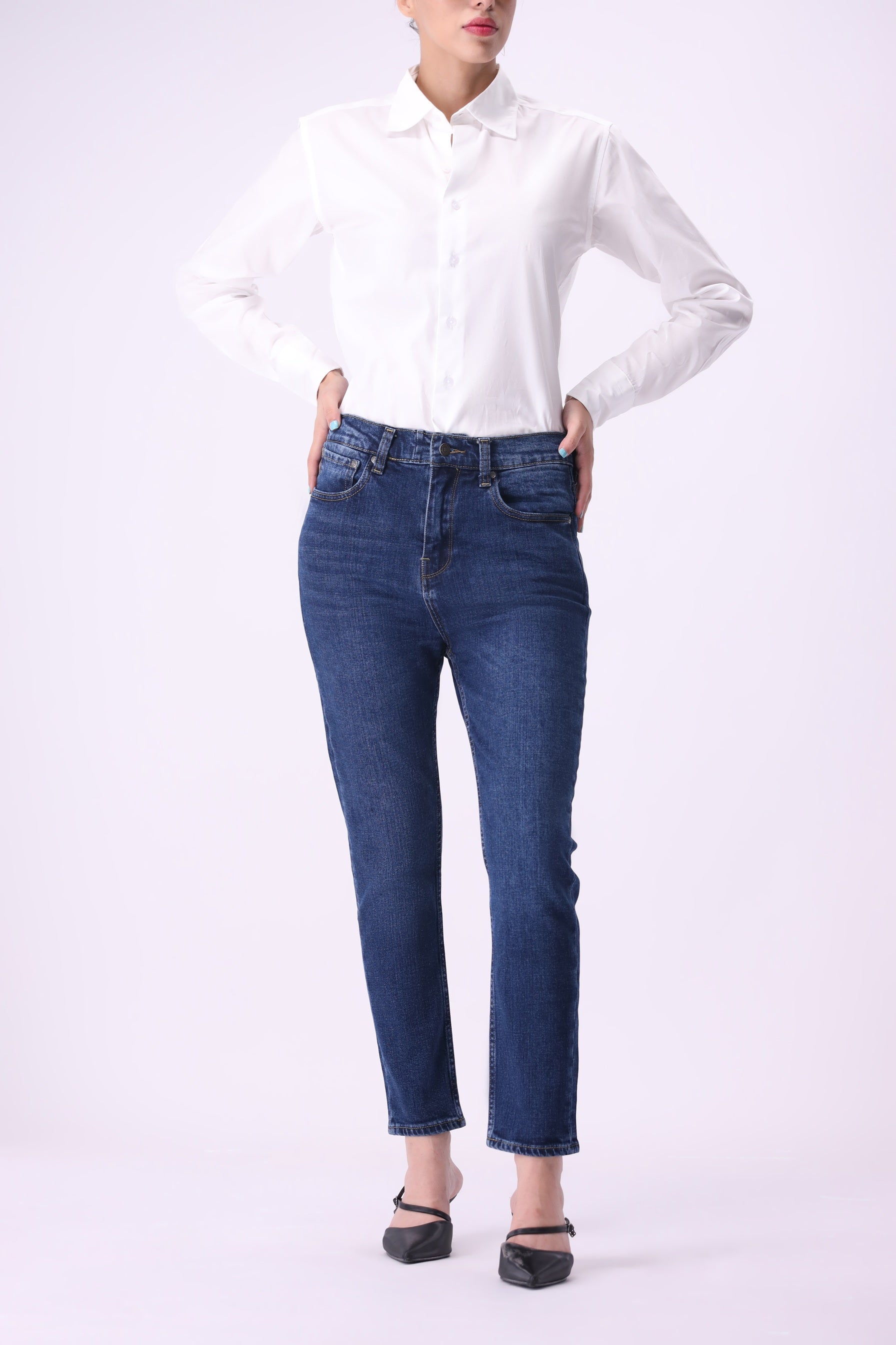 Full length front view of women’s Shirikaba dark indigo boyfriend jeans, high rise.