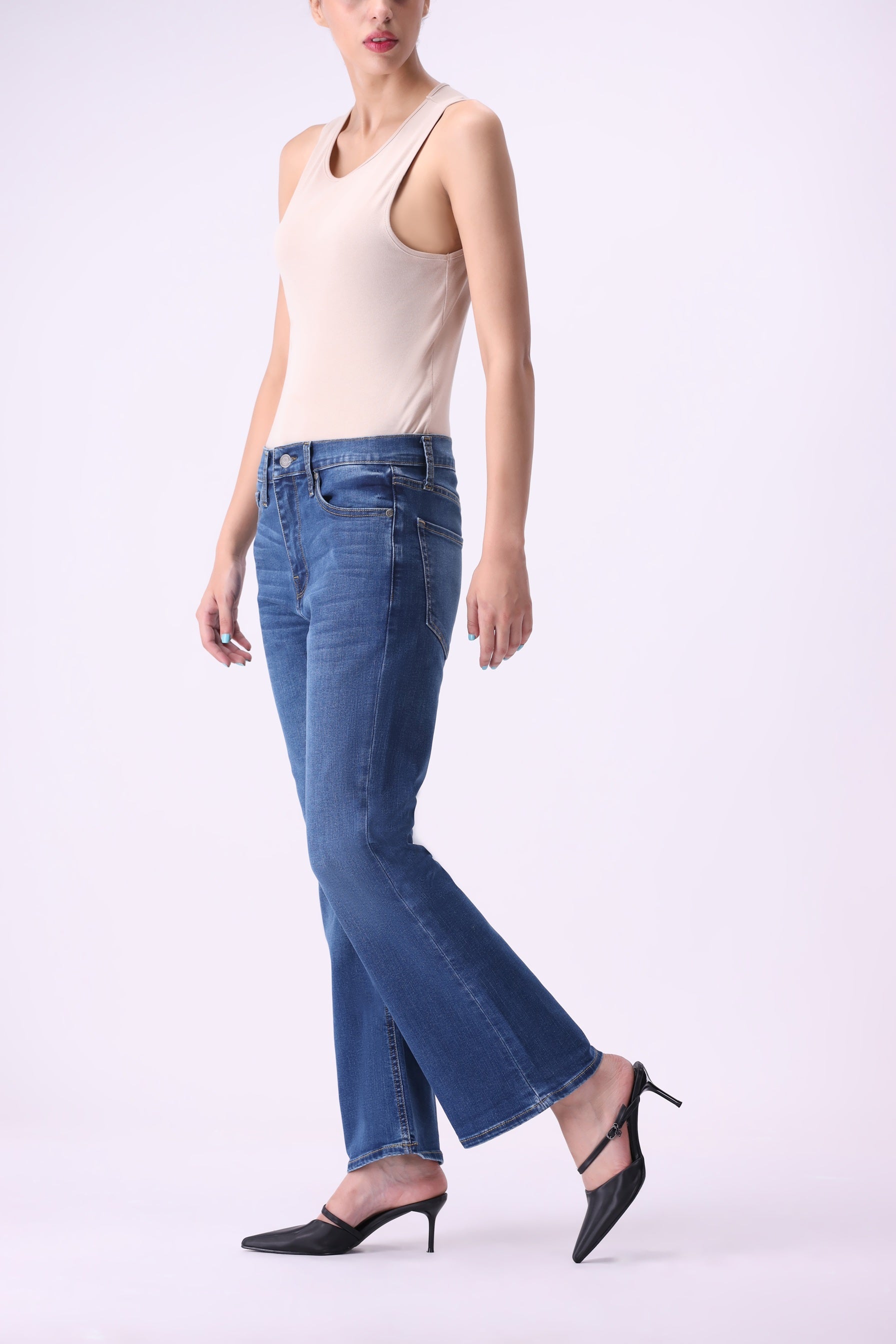 Side view of Bear & Birches Canoe women’s bootcut flare jeans, medium blue wash