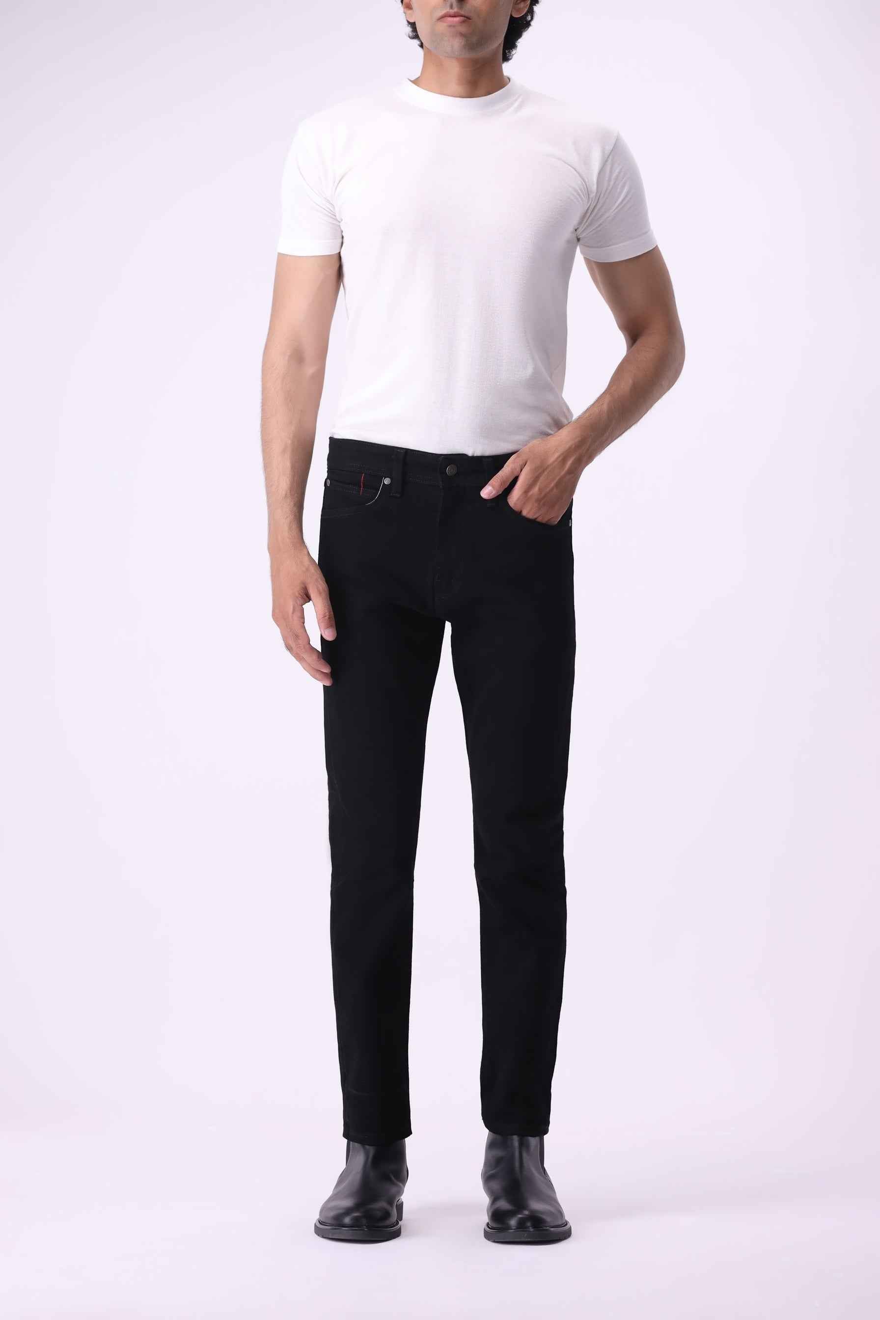 Medved men's modern slim-fit jeans in deep black, crafted from organic cotton and PCW recycled fibers.