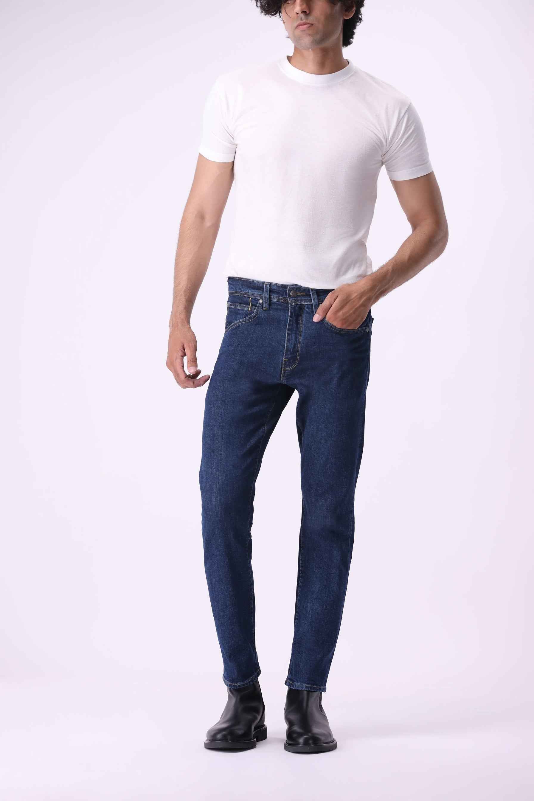 Ursa men's straight slim jeans in a rich indigo wash, featuring 65% organic cotton and 33% Tencel™.